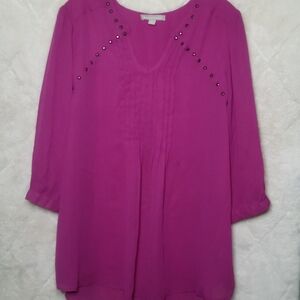 Woman Within Magenta Blouse with Button Accents